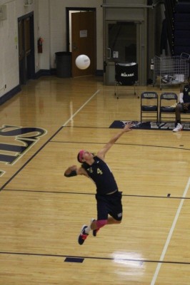 Varina senior strong side hitter Cole Dunkum serves the ball to the Henrico Warriors at their match on October 28. Varina emerged the victor, 25 to 20.